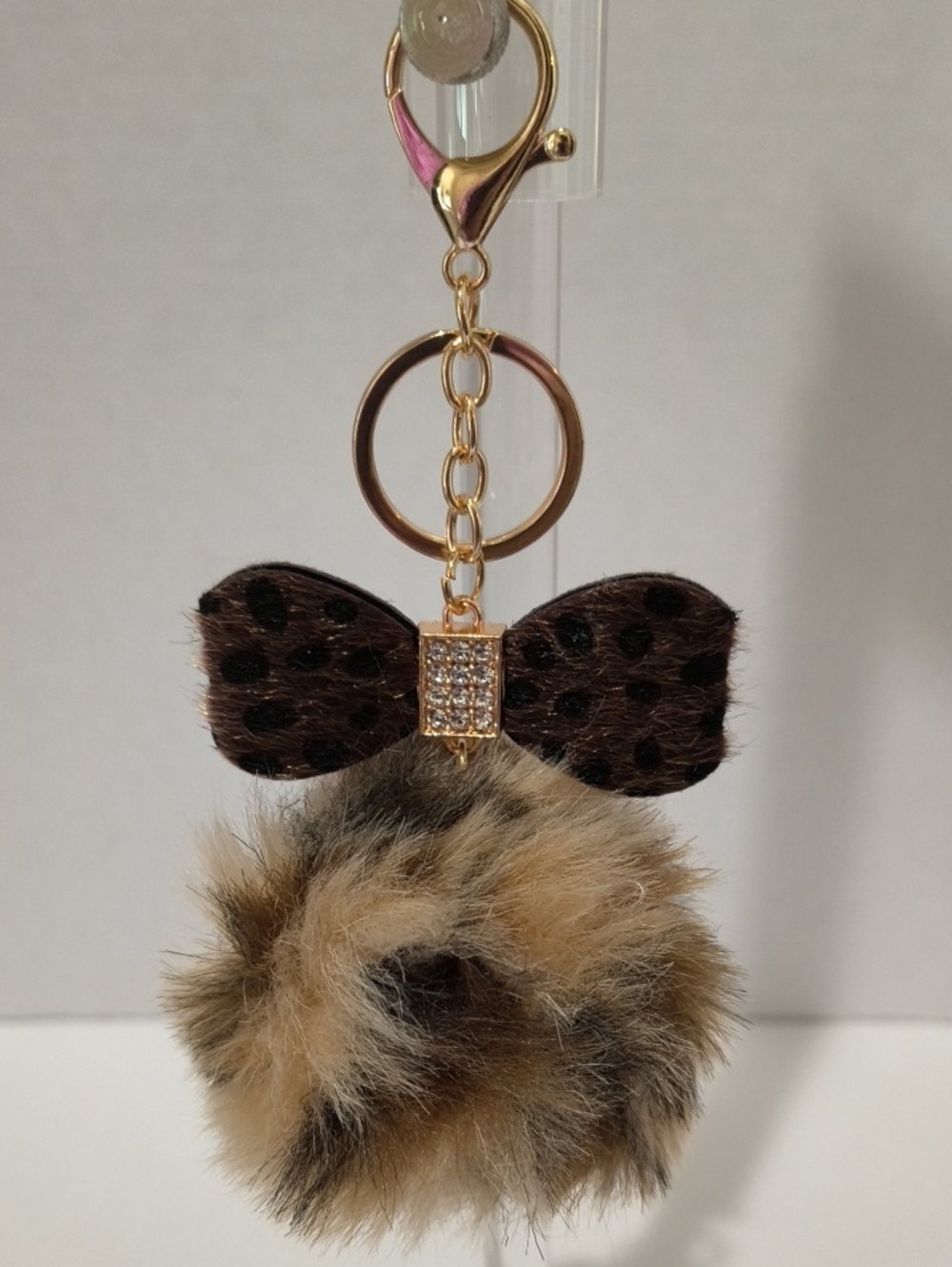 Gold Keyring Pom Pom Bag Charm with Brown Leopard Bow